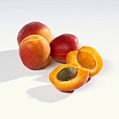 Several apricots, whole and halved