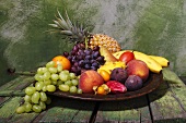 Plate of fruit on rustic wooden table