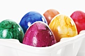 Easter eggs in egg holder (close-up)