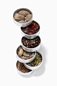 Assorted spices in small tins (stacked)