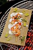 Barbecued prawn skewers with melon and lime yoghurt