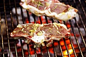 Marinated lamb chops on barbecue rack