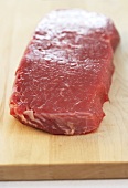 Fresh beef on chopping board