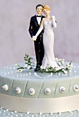 Wedding cake with bride and groom cake toppers