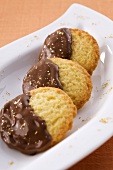 Butter biscuits with chocolate icing and gold powder