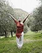Woman doing yoga in olive grove