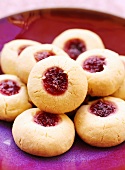 Jam biscuits on red plate