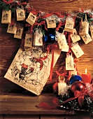 Advent calendar of brown paper bag hanging on wall
