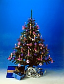 Christmas tree decorated with pink and purple decorations