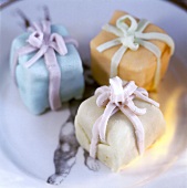 Close-up of marzipan chocolates in the shape of a gift pack