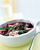 Close-up of bean pot with beetroot in bowl