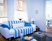 Striped fabric in blue and white adorns on sofa