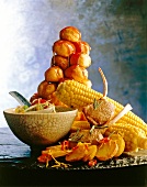 Stack of puffs with Thai soup, corn, lamb steaks and baked potatoes