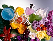 Multi-coloured flowers, perfume bottles and cream jars