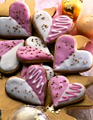 Heart shaped cookies with vanilla and strawberry icing