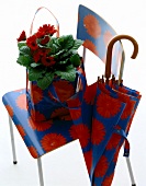 Red and white floral pattern chair umbrella and bag with flowers