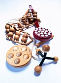 Various wooden massage roller on white background