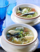 Mallorcan fish soup in white bowl