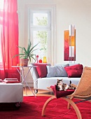 Living room with roller sofa, red curtain and carpet