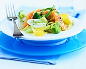 Pasta with smoked salmon and broccoli on plate