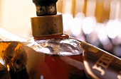 Close-up of brandy bottle being hand sealed, Bodega Fernando de Andrada