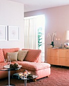 Striped sofa and wooden sideboard on pink flash carpet in living room