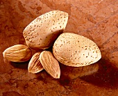 Close-up of shelled and unshelled almonds