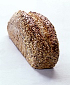 Rye bread with sesame and pumpkin seeds on white background