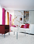 Living room with sofa, curtains and cushions