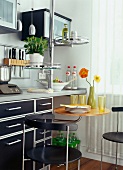 Space saving kitchen with swivel chairs and rotating table