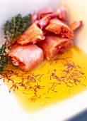 Close-up raw rabbit marinated in saffron and thyme