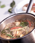 Close-up of tom yam soup boiling in a pot