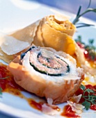 Close-up of sole and salmon roulade, pappardelle with tomato and parmesan sauce