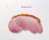 Slice of roasted pork on white background