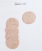 Slices of sausage on white background
