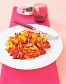 Pasta with tomato and apricot sauce on plate