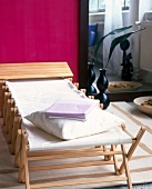 Pillow on unfolded wooden cot