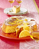 Almond cake with slices of orange on plate