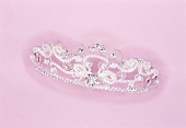 Close-up of beaded crown on pink background