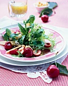 Close-up of corn salad with cherries and melon on plate