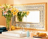 Bathroom with oriental patterned mosaic mirror near wash basin