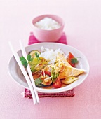 Vegetables and basmati rice in bowl with chopsticks