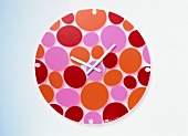 Pebbles Wall Clock with points on white background