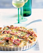 Close-up of mushroom tart with ham, cheese, eggs and soy cream