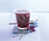 Cherry walnut jam packed in a glass with transparent film