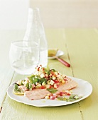 Apple salsa with salmon on plate