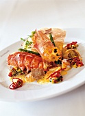 Close-up of breton lobster with white truffle and scallops on plate