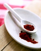 Close-up of paprika in bowl with spoon