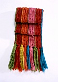 Colourful woolen scarf on white background