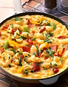 Close-up of vegetable pasta omelette in frying pan